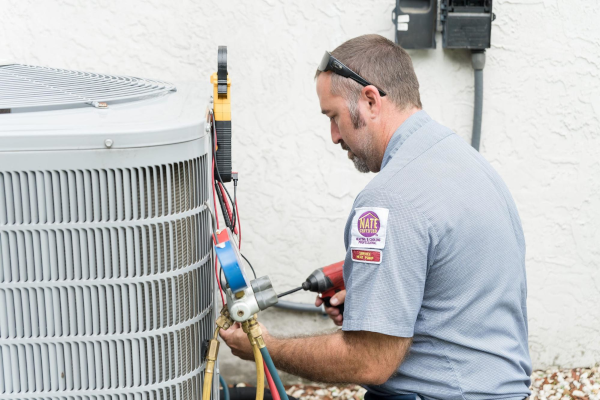 HVAC Technician inspecting unit